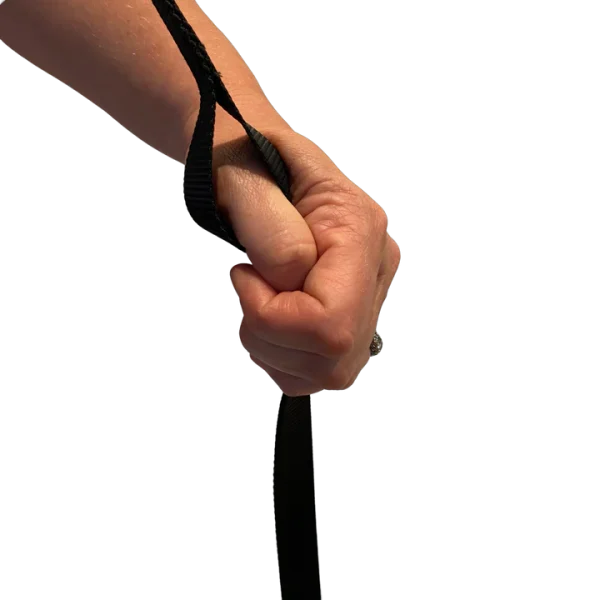 A hand holding onto the handle of a pole.